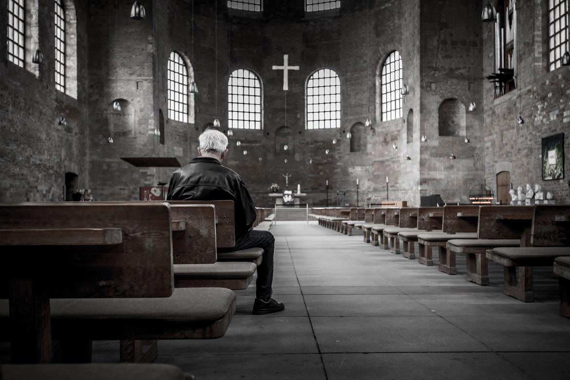 Man Sitting in Church